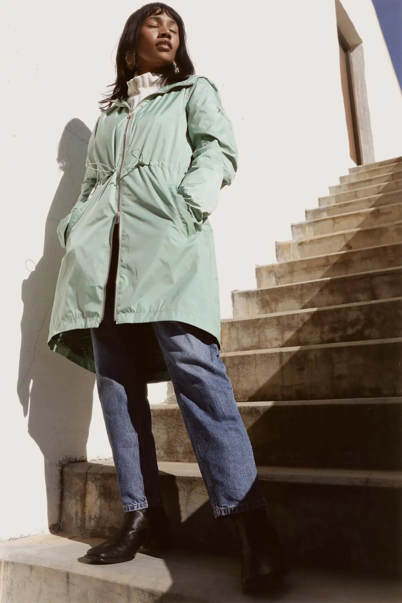 Madame Verde Vol 1 mint green hooded raincoat, lightweight waterproof jacket perfect for wet weather in Australia.