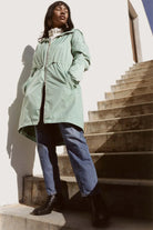 Madame Verde Vol 1 mint green hooded raincoat, lightweight waterproof jacket perfect for wet weather in Australia.