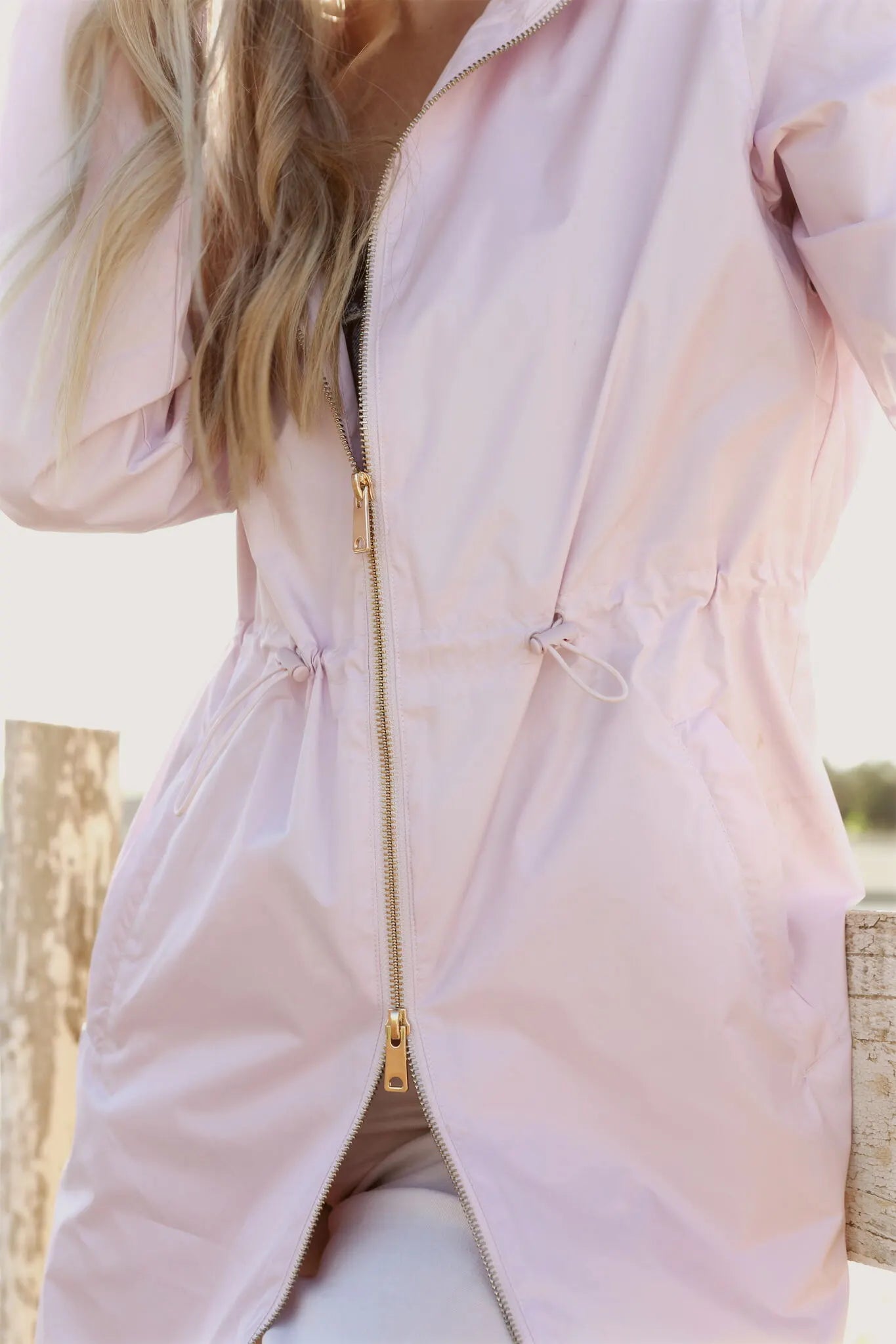 Rosewater Mist pastel pink hooded raincoat, modern lightweight waterproof raincoat perfect for wet weather in Australia.