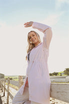 Rosewater Mist pastel pink hooded raincoat, modern lightweight waterproof raincoat perfect for wet weather in Australia.