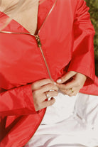 Lipstick Crush No 5 bright red hooded raincoat, modern lightweight waterproof raincoat perfect for wet weather in Australia