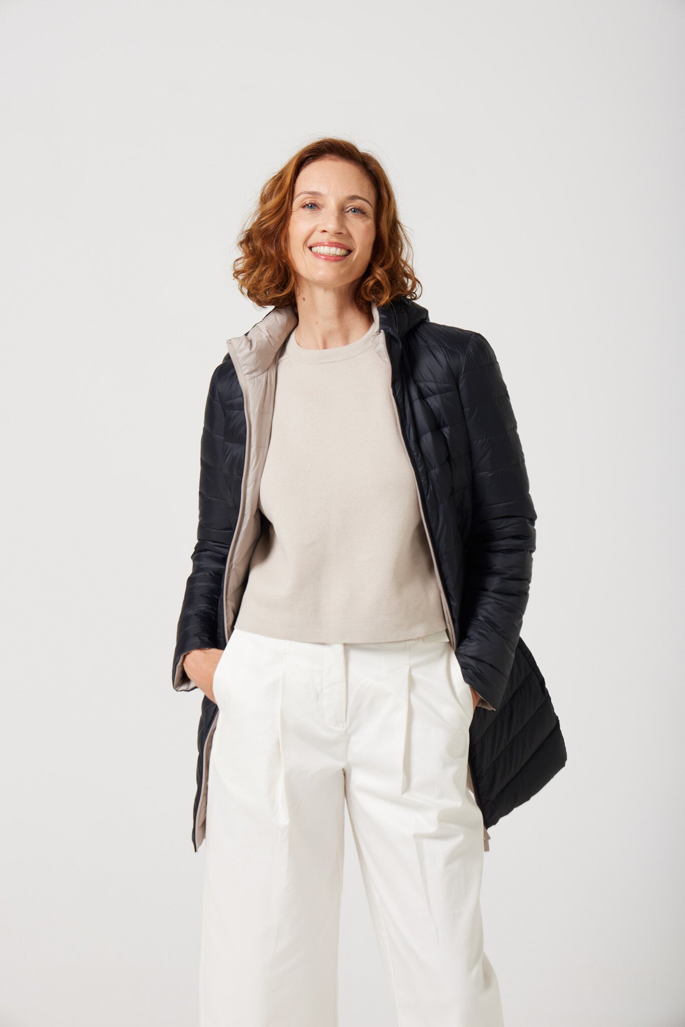 Women’s ebony black and ivory reversible insulated parka with hood, warm winter parka perfect for layering in Australia’s cooler weather — Ebony x Ivory Classic Parka™