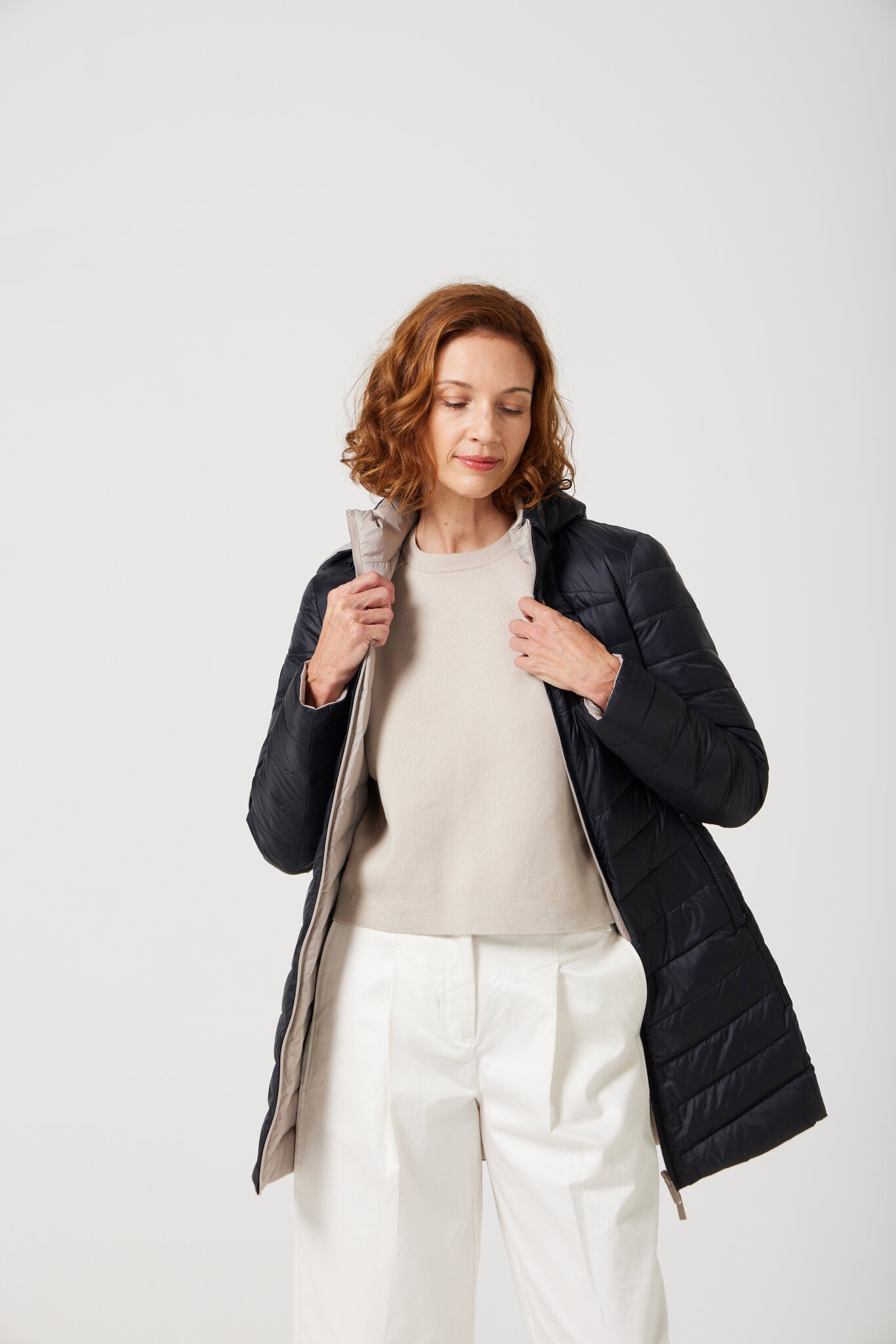 Women’s ebony black and ivory reversible insulated parka with hood, warm winter parka perfect for layering in Australia’s cooler weather — Ebony x Ivory Classic Parka™