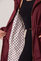 hear lining of a maroon raincoat