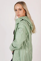 Madame Verde Vol 1 mint green hooded raincoat, lightweight waterproof jacket perfect for wet weather in Australia.