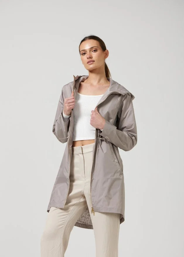 The Cairo Sands beige hooded raincoat, modern lightweight waterproof raincoat perfect for Australia’s weather and rain