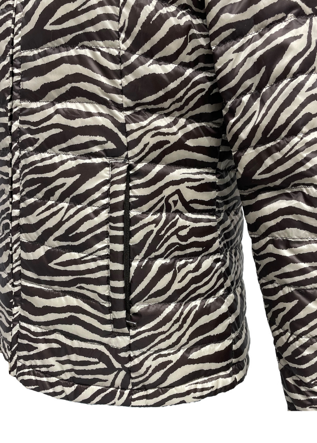close up of the pocket of a zebra stripe duck down puffer jacket